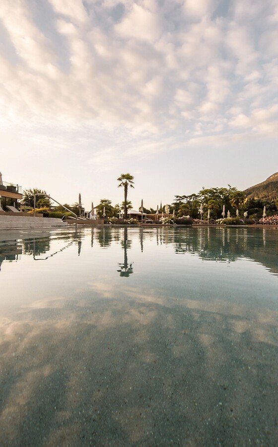 Man and woman in wedding attire at champagne reception