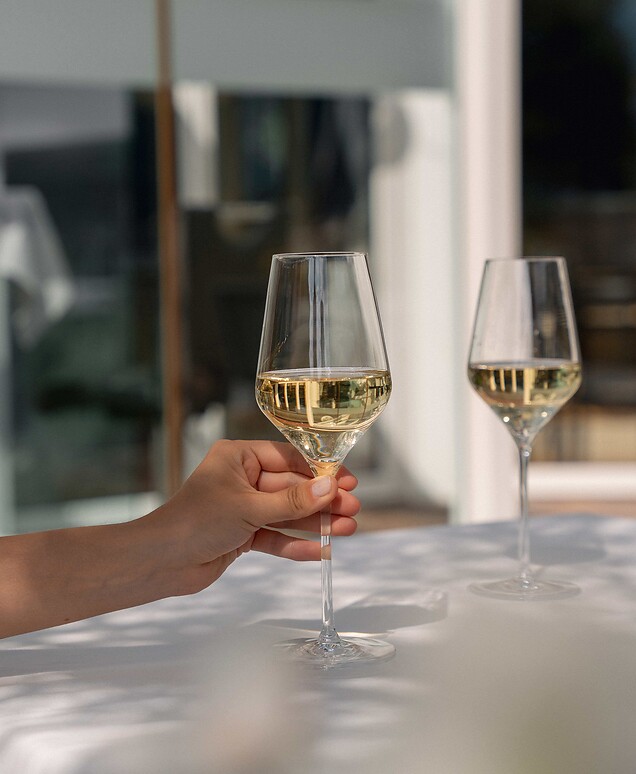 Guest enjoying a glass of Prosecco on the sun terrace