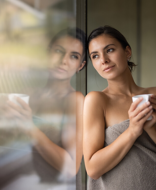 Woman relaxing at the Sky Spa with a cup of tea