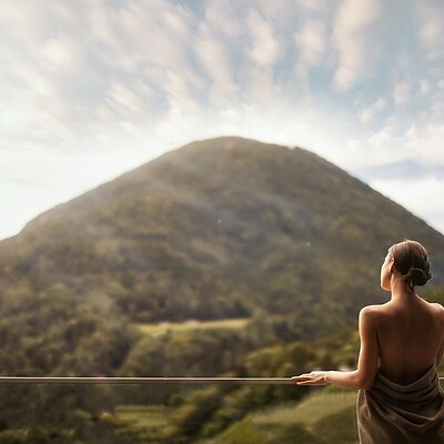 Woman standing on the terrace with mountain views