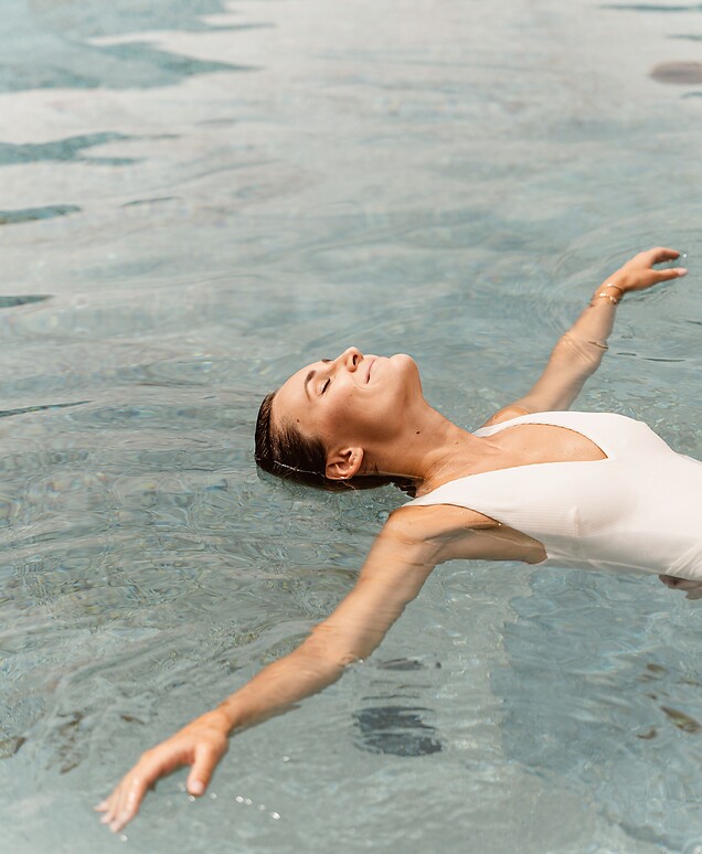 Woman floating in the natural pool