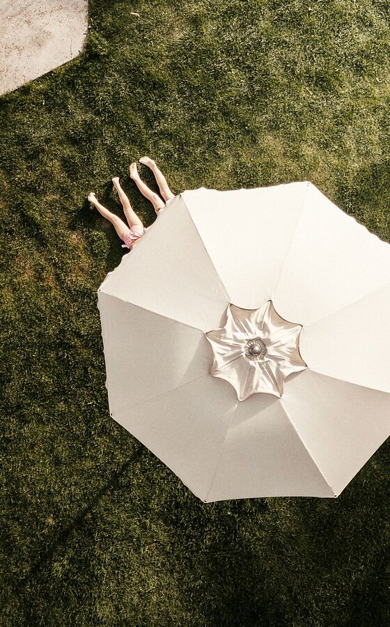 Sun umbrella in the garden from a bird’s-eye view