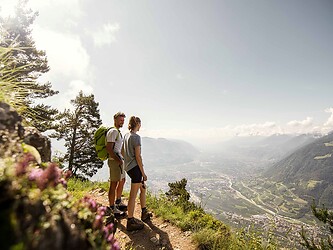 Woman and man on a spring hike in the mountains