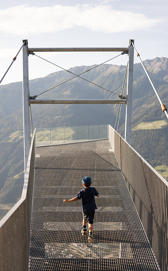 Child running onto the viewing platform at Unterstell with a panoramic view