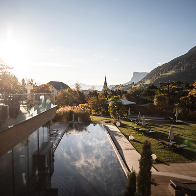 Outdoor infinity pool and hotel garden in autumn